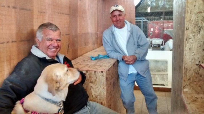 Plywood interior Dan leaning on galley.jpg