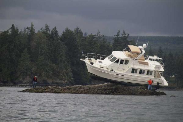 My current boat when it was new and named "Dream Weaver".  The new owner found this handy rock at high tide.