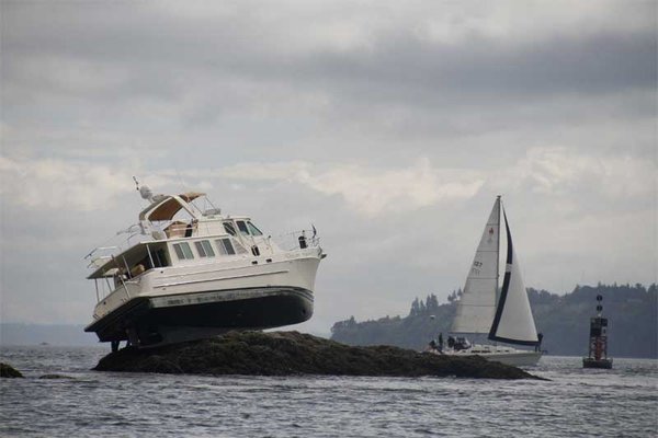 My current boat when it was new and named "Dream Weaver".  The new owner found this handy rock at high tide.