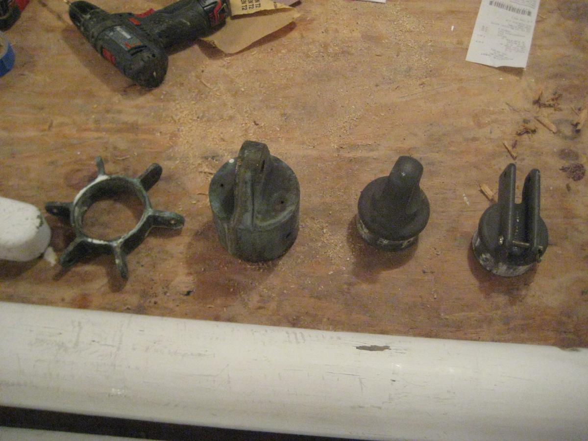 On the left are the two bronze castings from the original mast. On the right are the two aluminum castings from the spinnaker pole. In any case, it wi