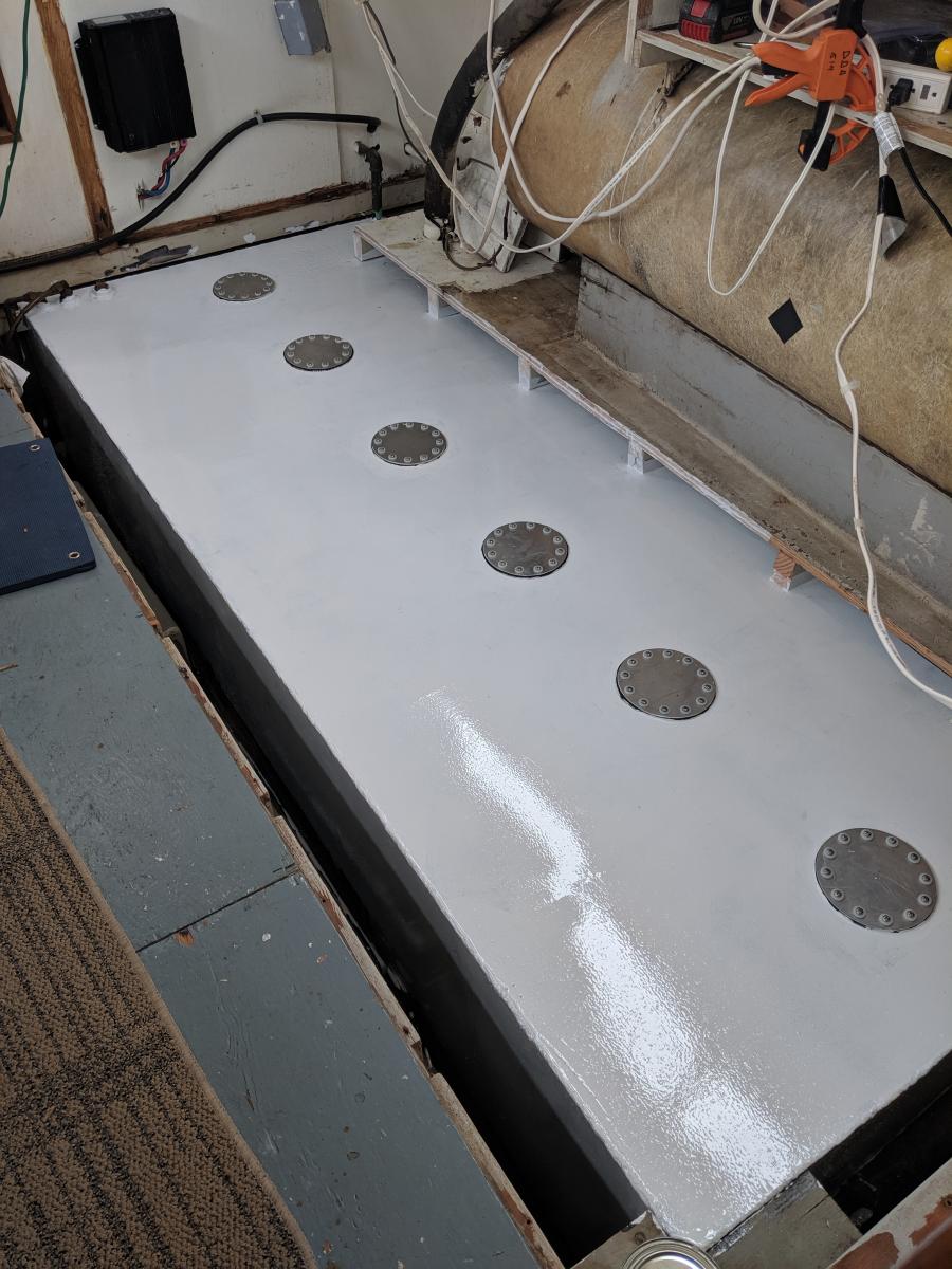 Refurbished port diesel fuel tank, 40" wide on top, 16" deep inner side, 96" long. Bottom tapers to about 6" on outboard side, holds 200 gallons. Dril